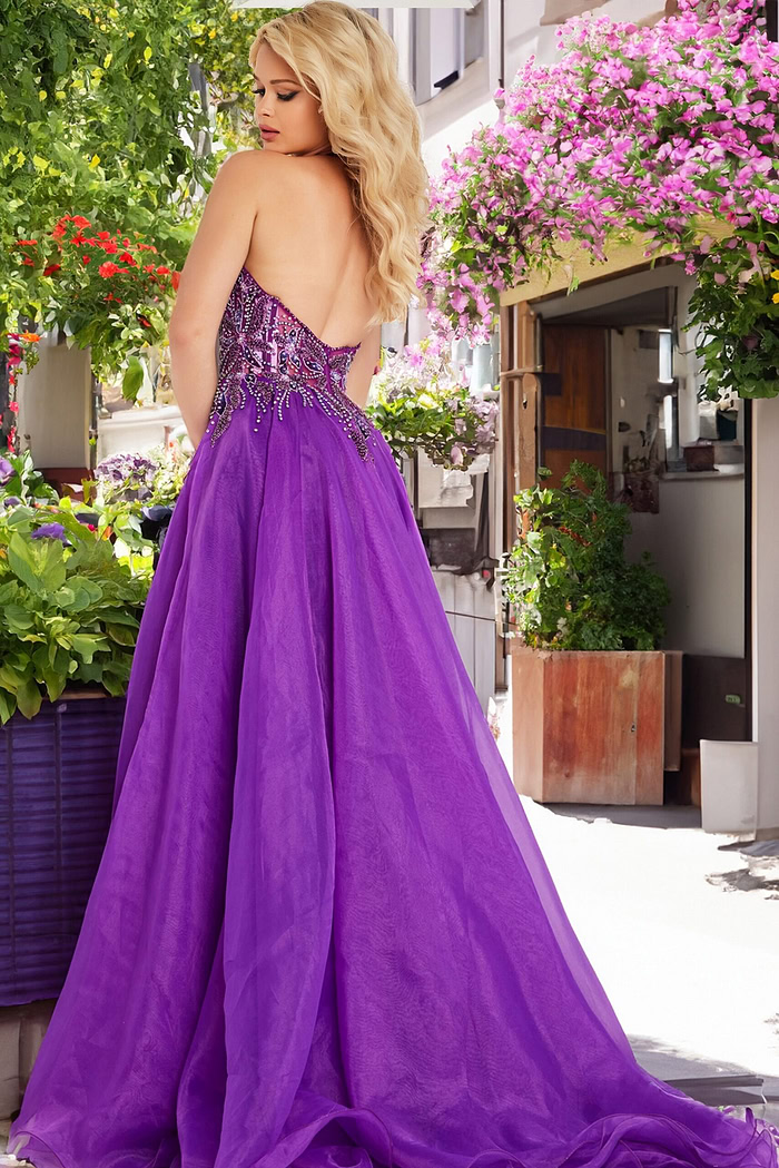 Model showcasing back of Jovani 25964 purple gown with open design