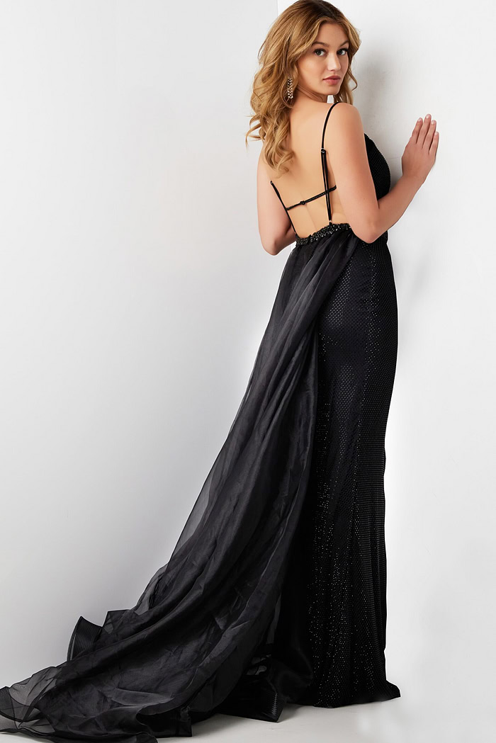 model showing back view of Jovani 25990 black gown with open back