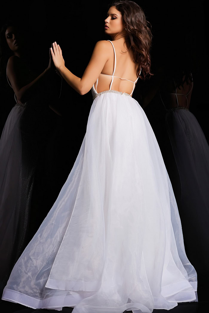 Back view of model wearing Jovani 25990 white gown with open back design.