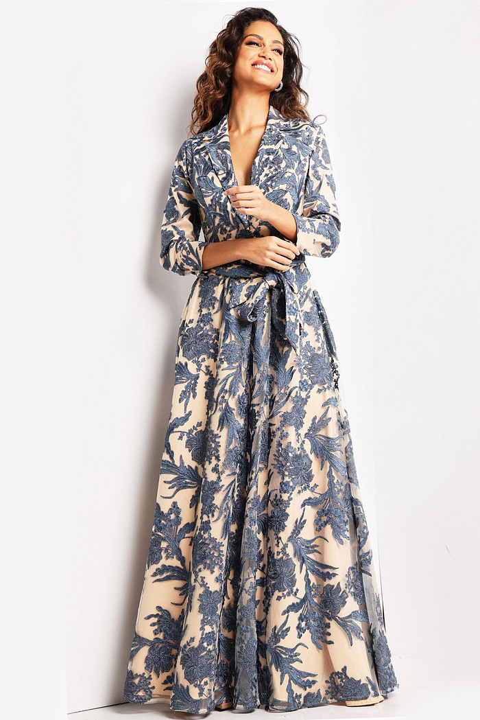 Model wearing Jovani 26148 navy and nude gown with V-neckline and floral details.