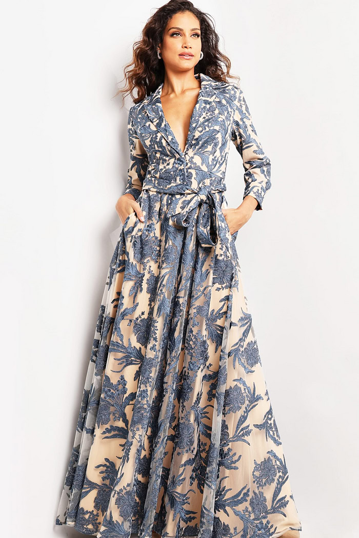 Model showcasing the Jovani 26148 gown with intricate floral patterns and three-quarter sleeves.