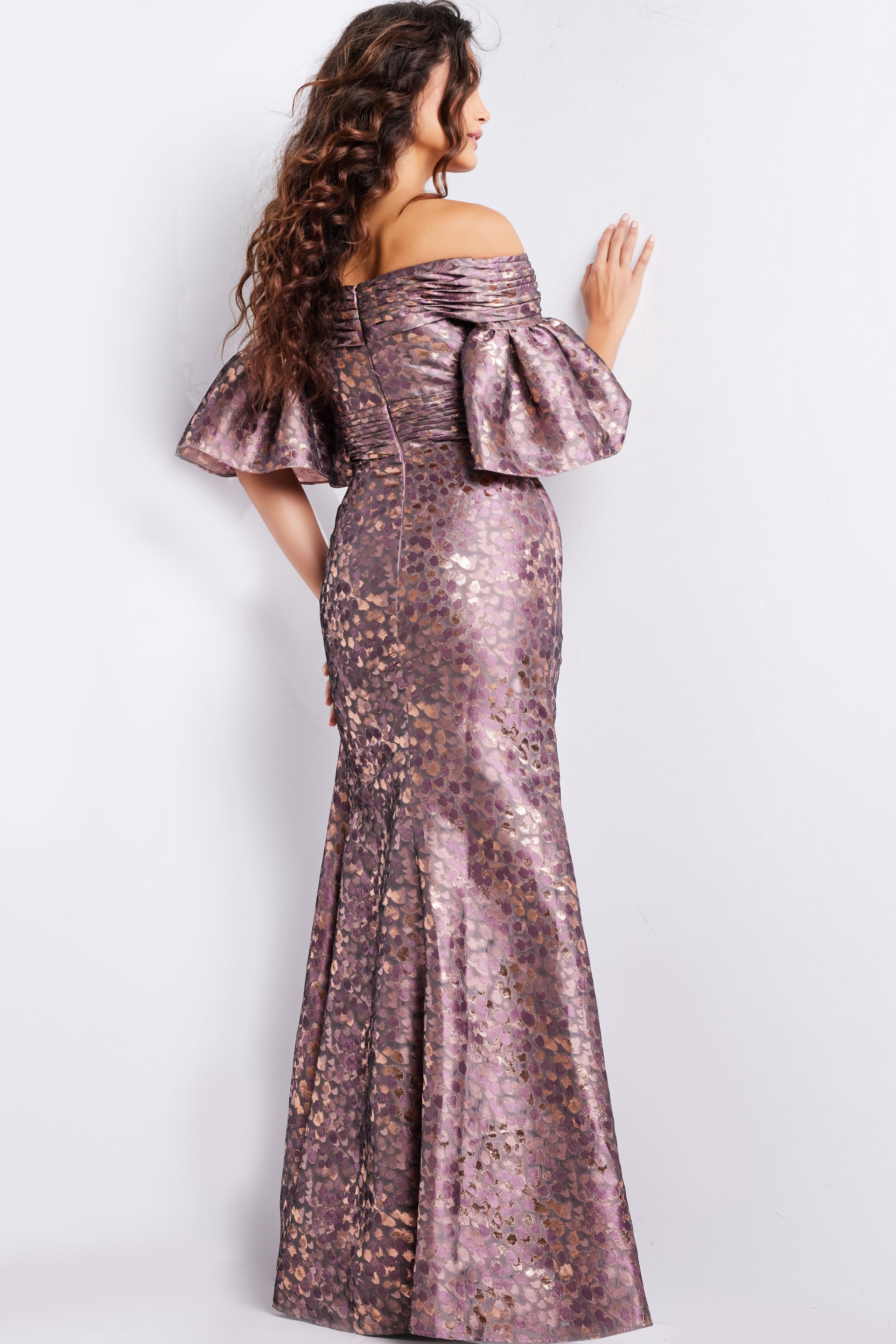 Back view of Jovani 26258 gold dress featuring ruffled sleeves.