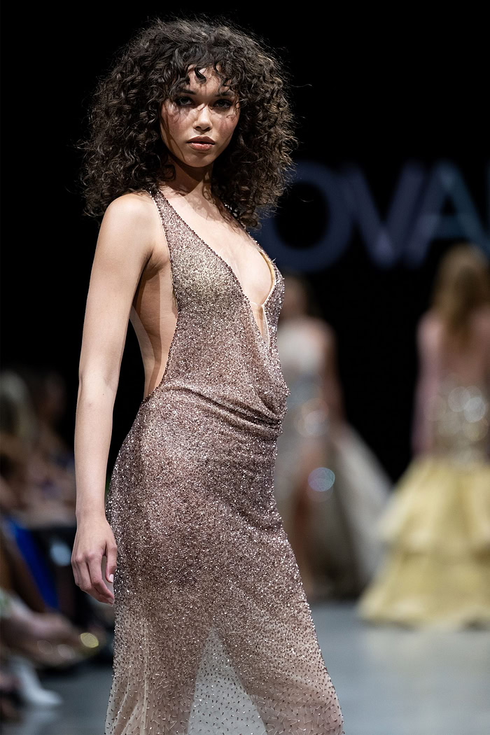 Model wearing Jovani 26268 displaying the dress's full length and shimmering sequin details.