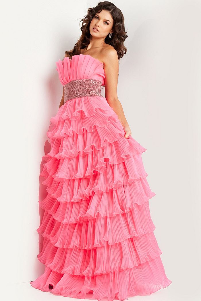 Model wearing Jovani 26314 pink gown elegantly posed.
