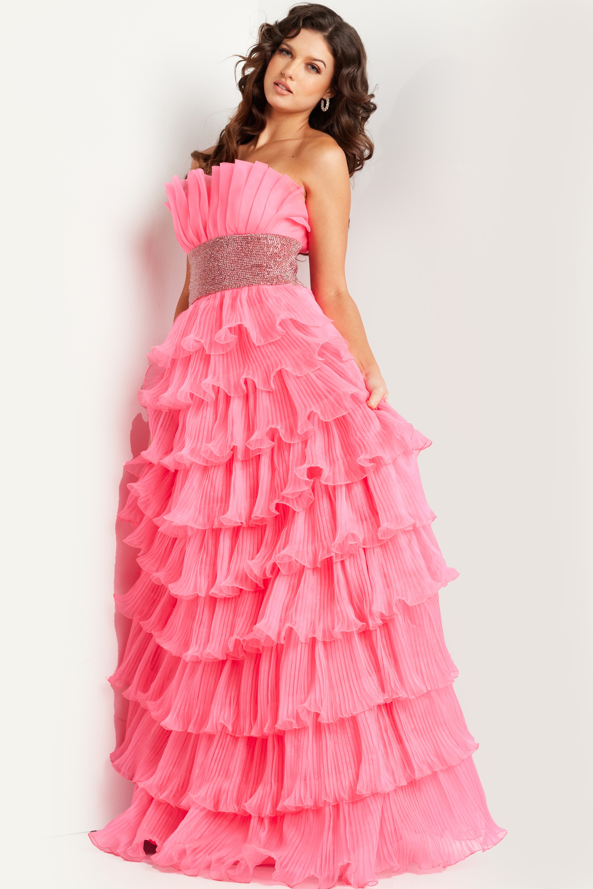 Model wearing Jovani 26314 pink gown elegantly posed.