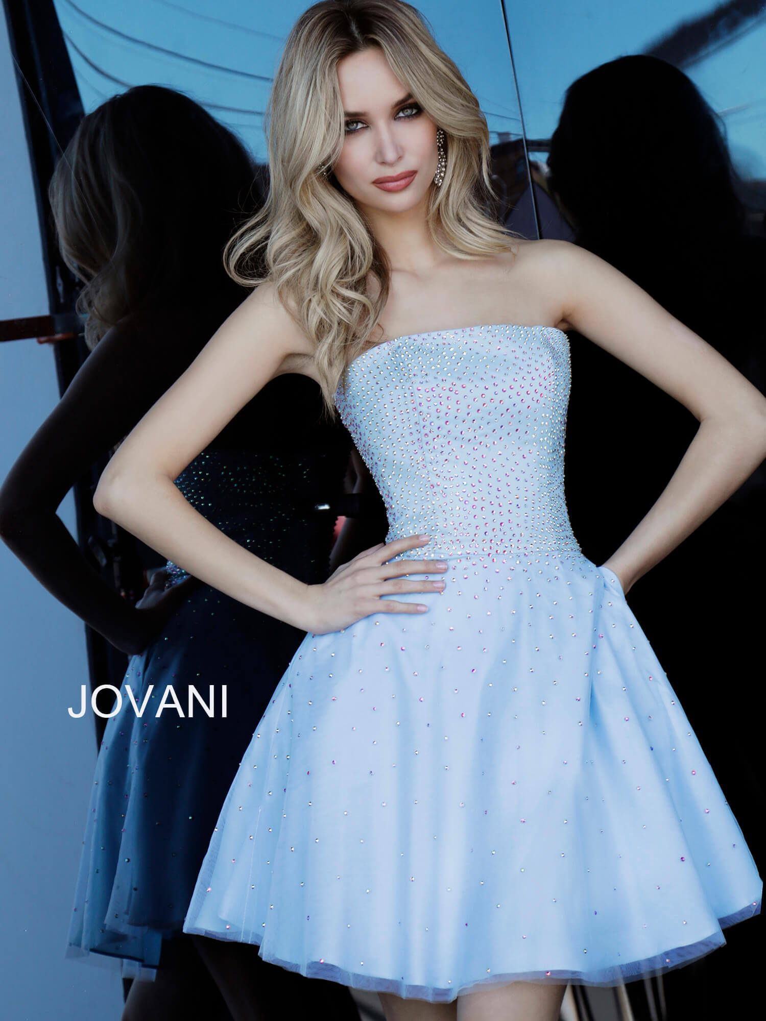 Front view of model with hands on hips wearing Jovani K2830 light blue dress.