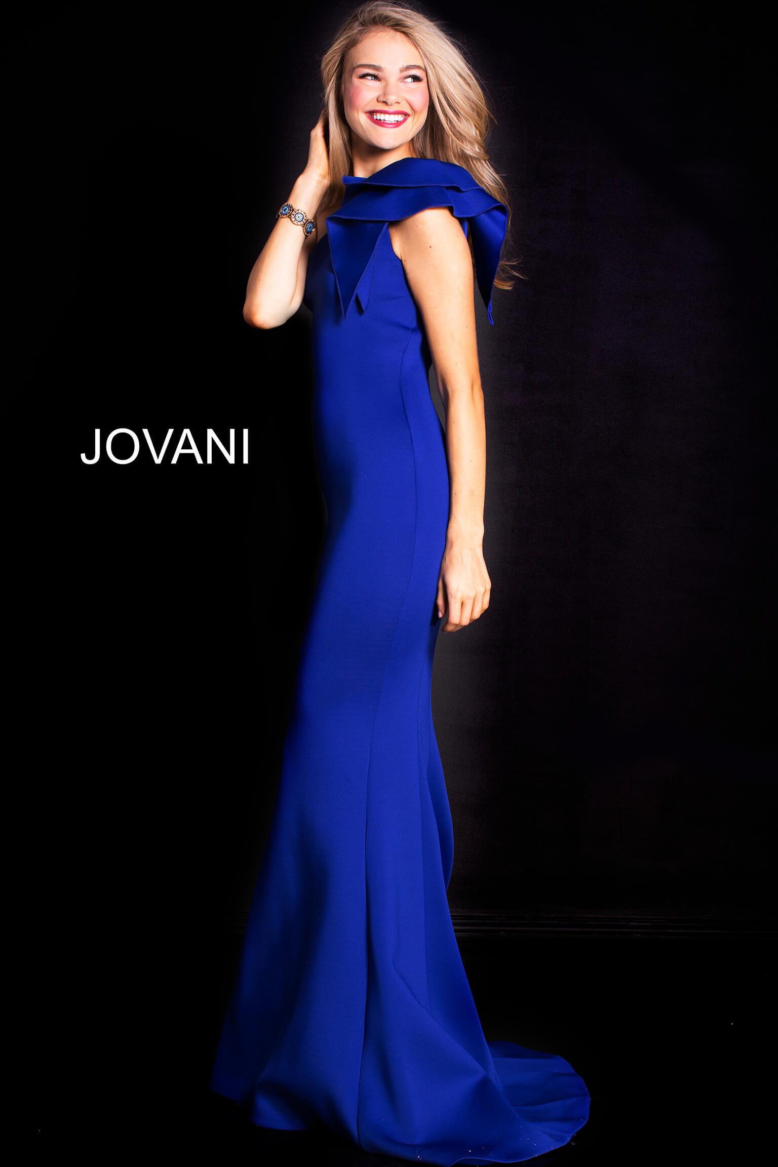 Side view of Jovani 32602 in royal blue showing the elegant mermaid fit