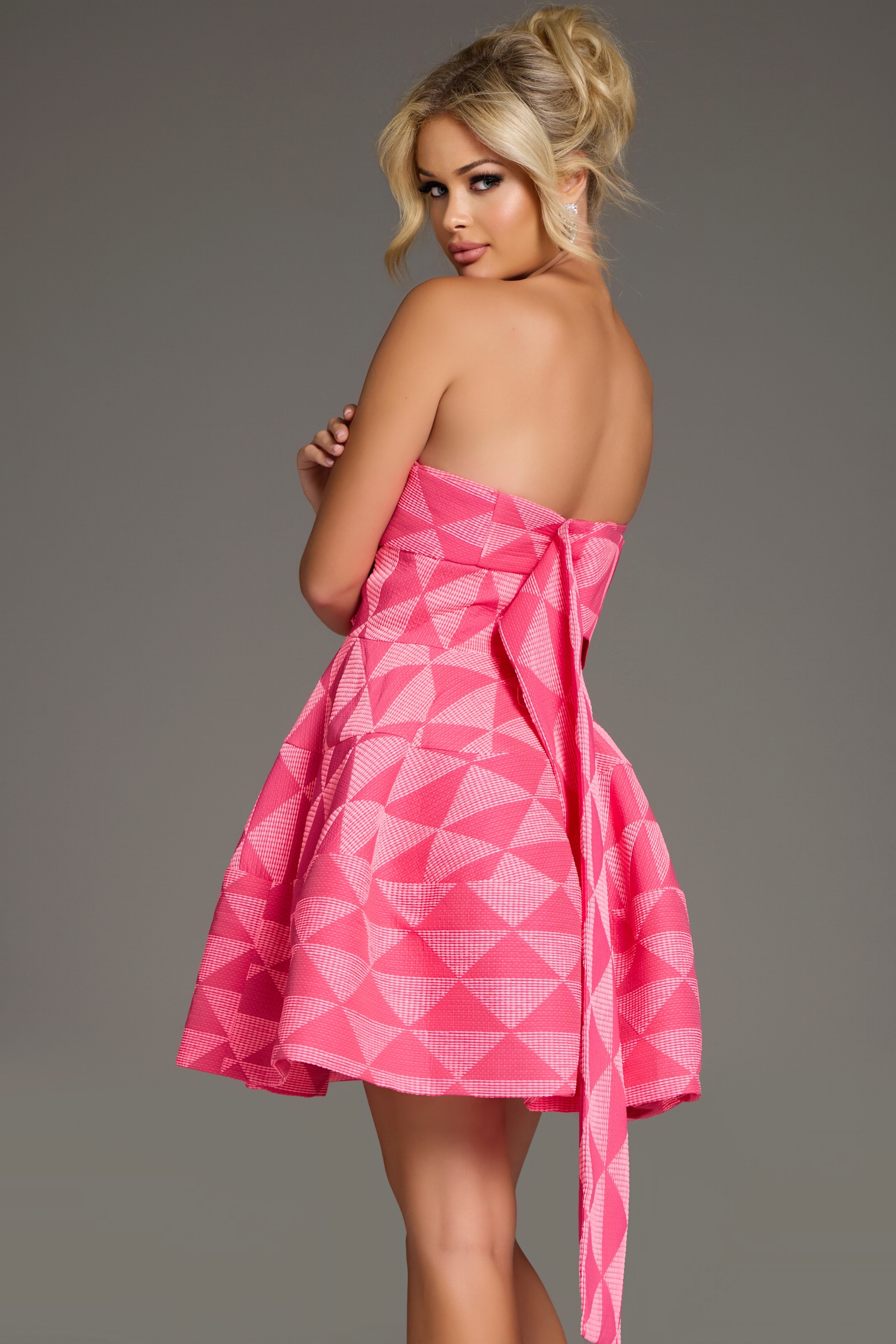 Model wearing Jovani 34404 pink dress back view
