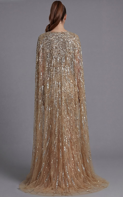 Back view of a beaded gown with flowing cape sleeves and fitted column silhouette
