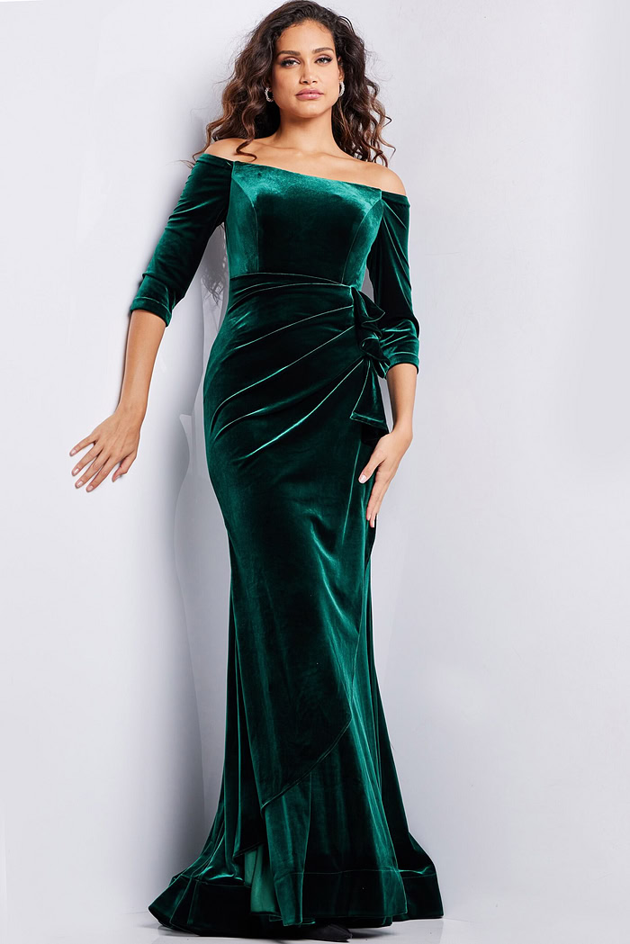 model wearing 36458 full-length green velvet dress with side ruching and off-the-shoulder neckline