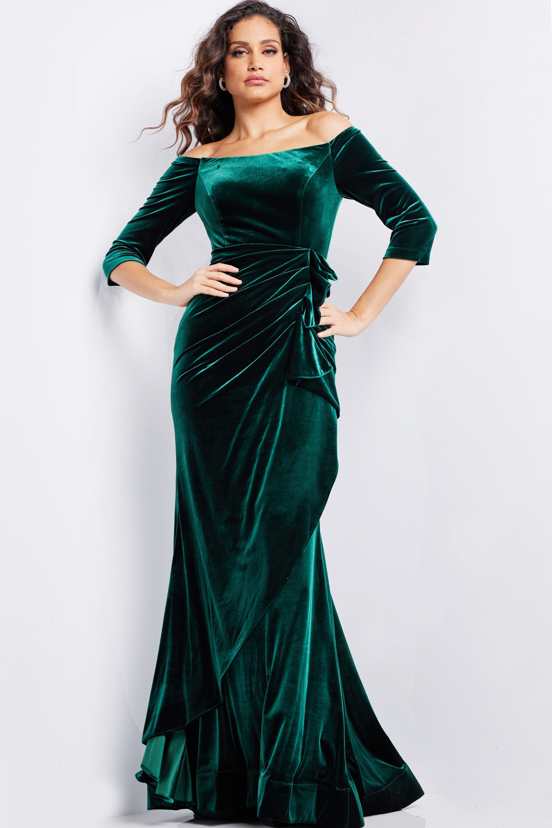 model in 36458 green velvet dress featuring three-quarter sleeves and floor-length design