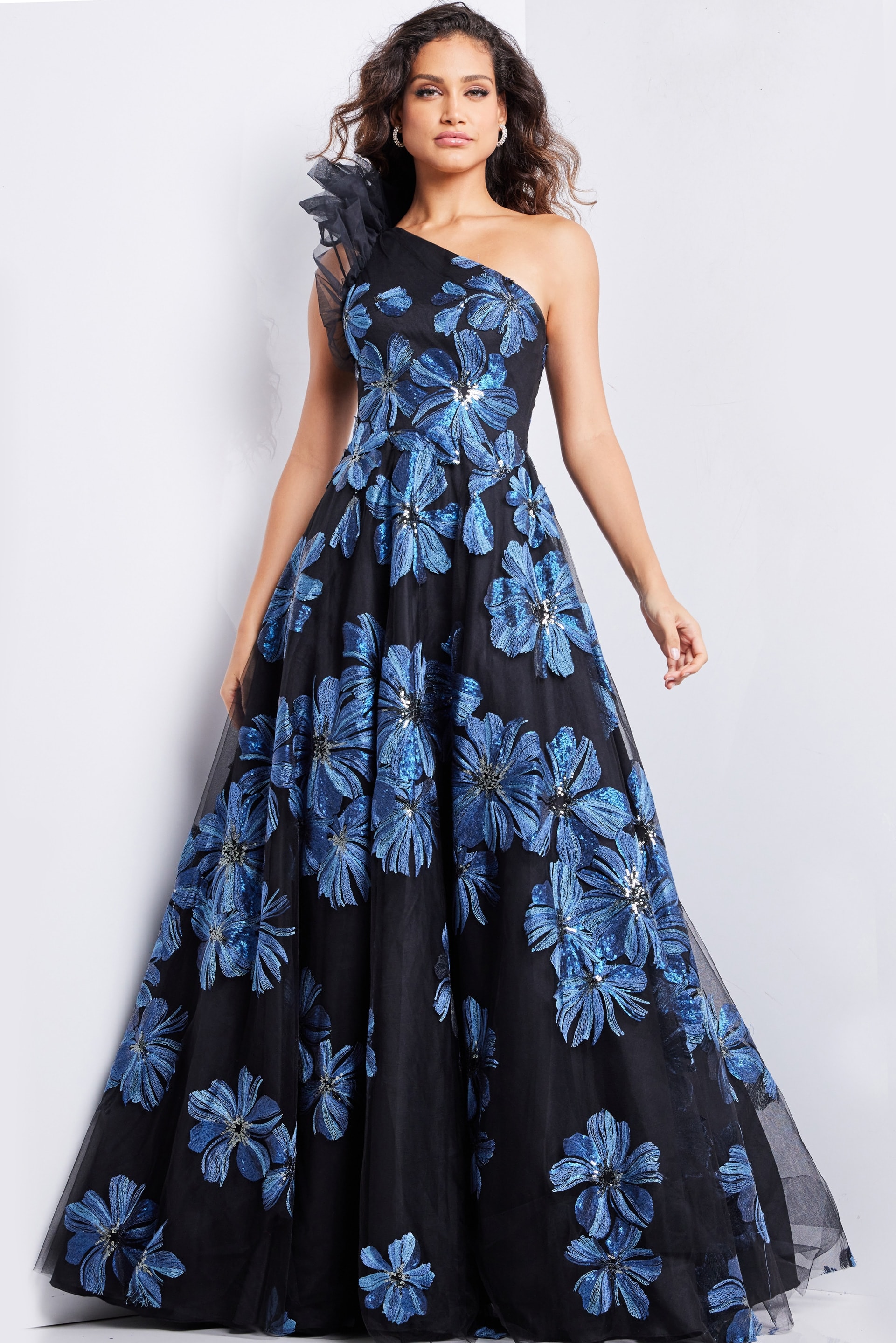 model showcasing Jovani 36717 navy gown with floral design