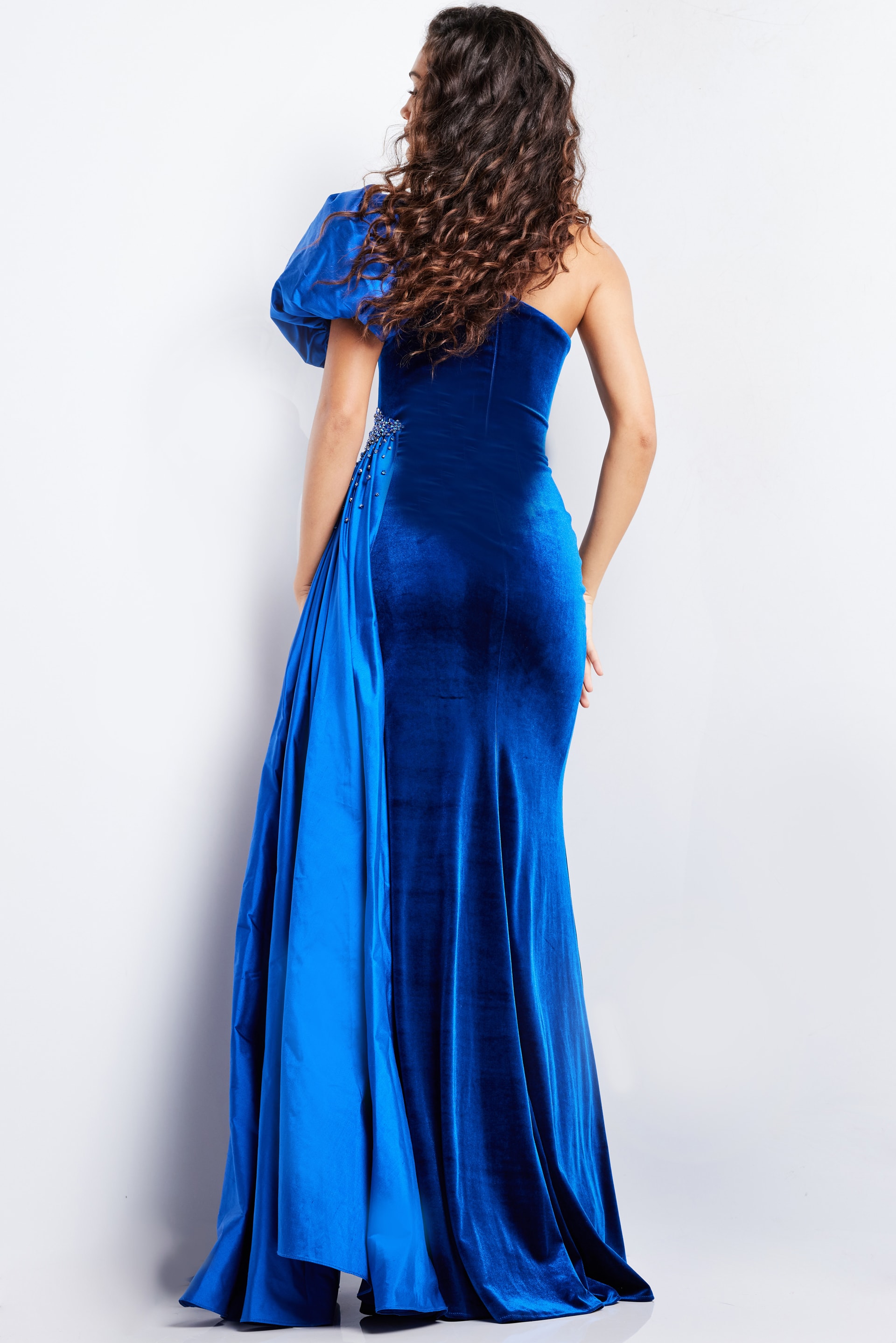 model wearing Jovani 36878 royal dress, view from the back