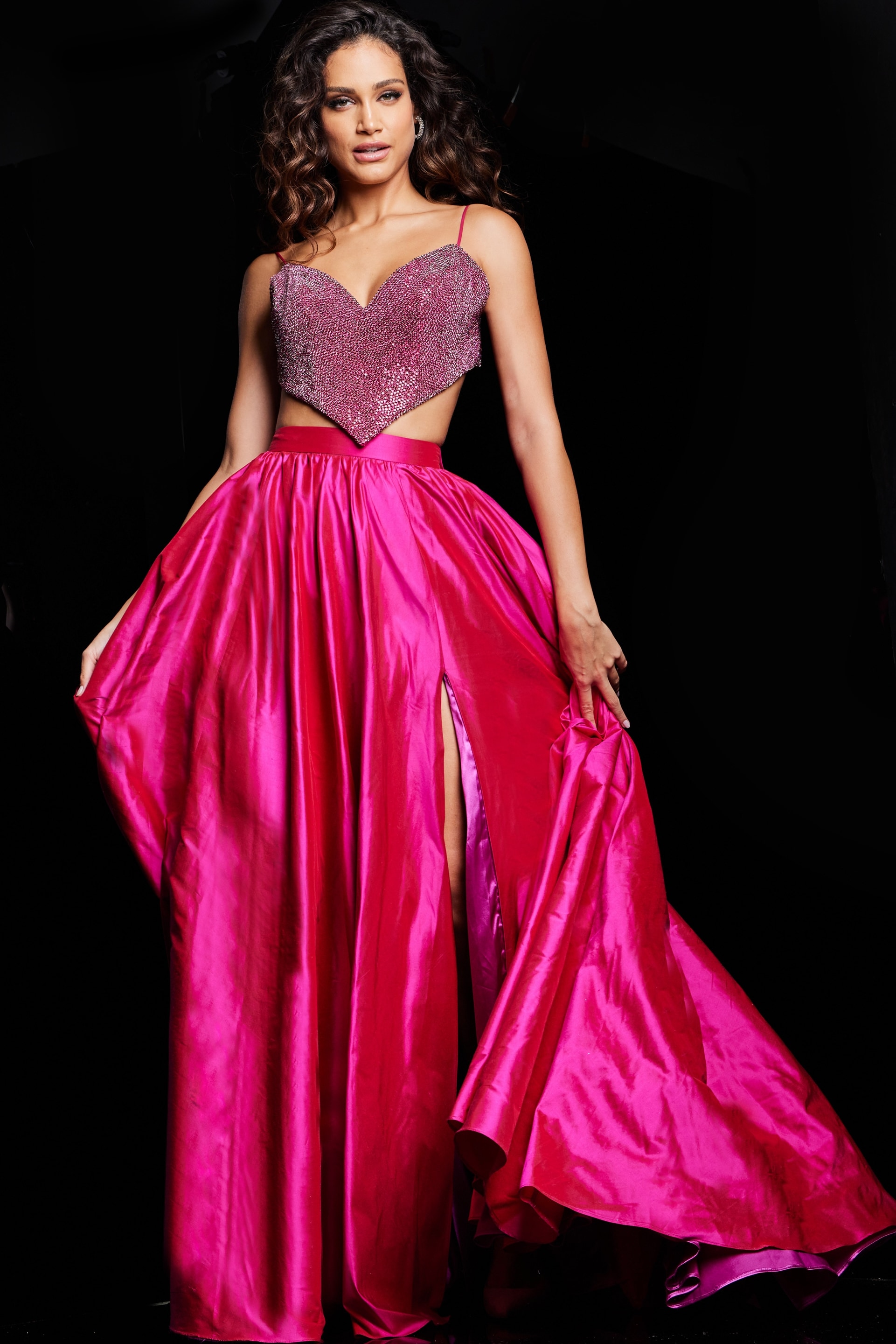 Model wearing fuchsia Jovani 37045 dress with embellishments and a high slit