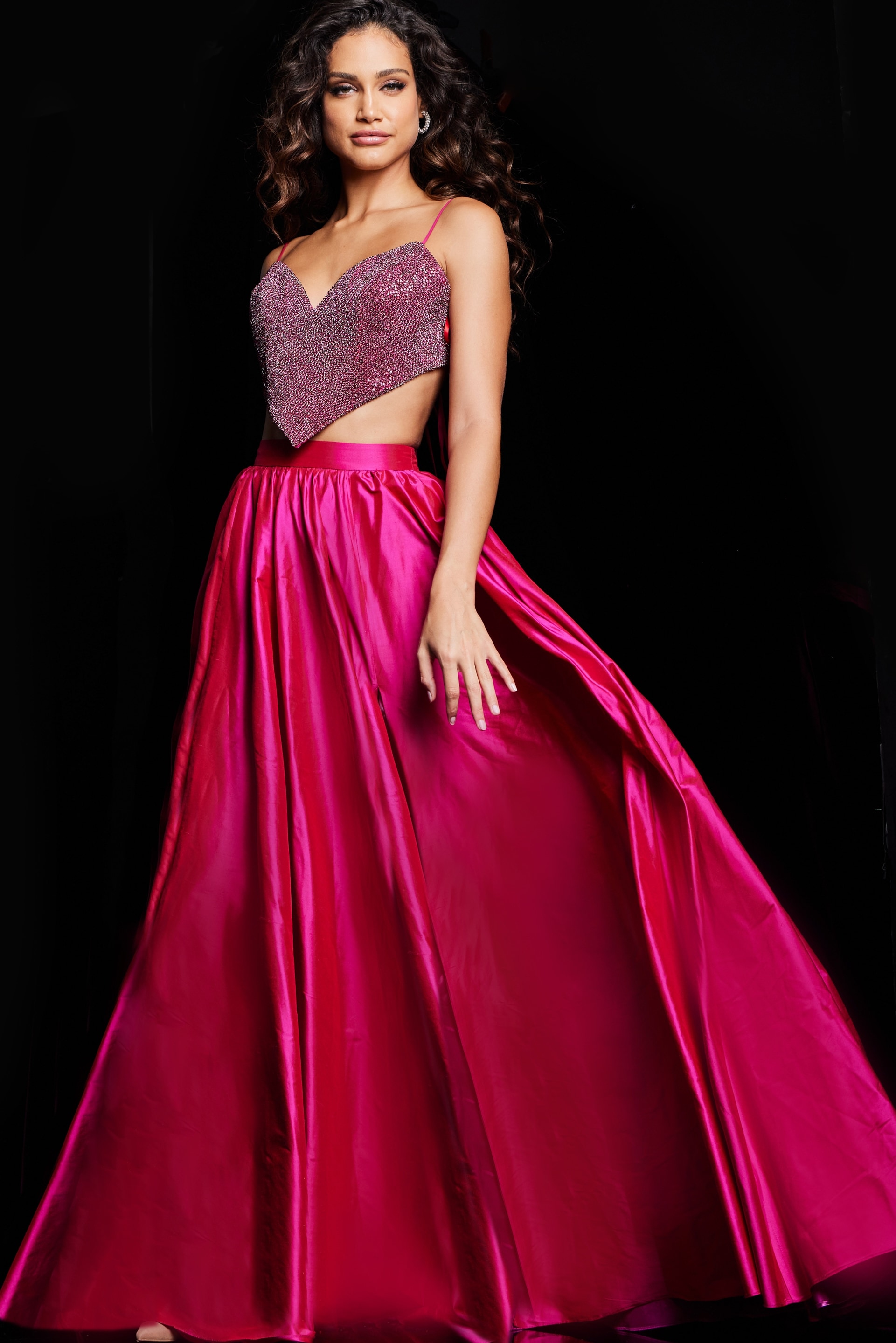 Model showing back of Jovani 37045 fuchsia dress with flowing skirt