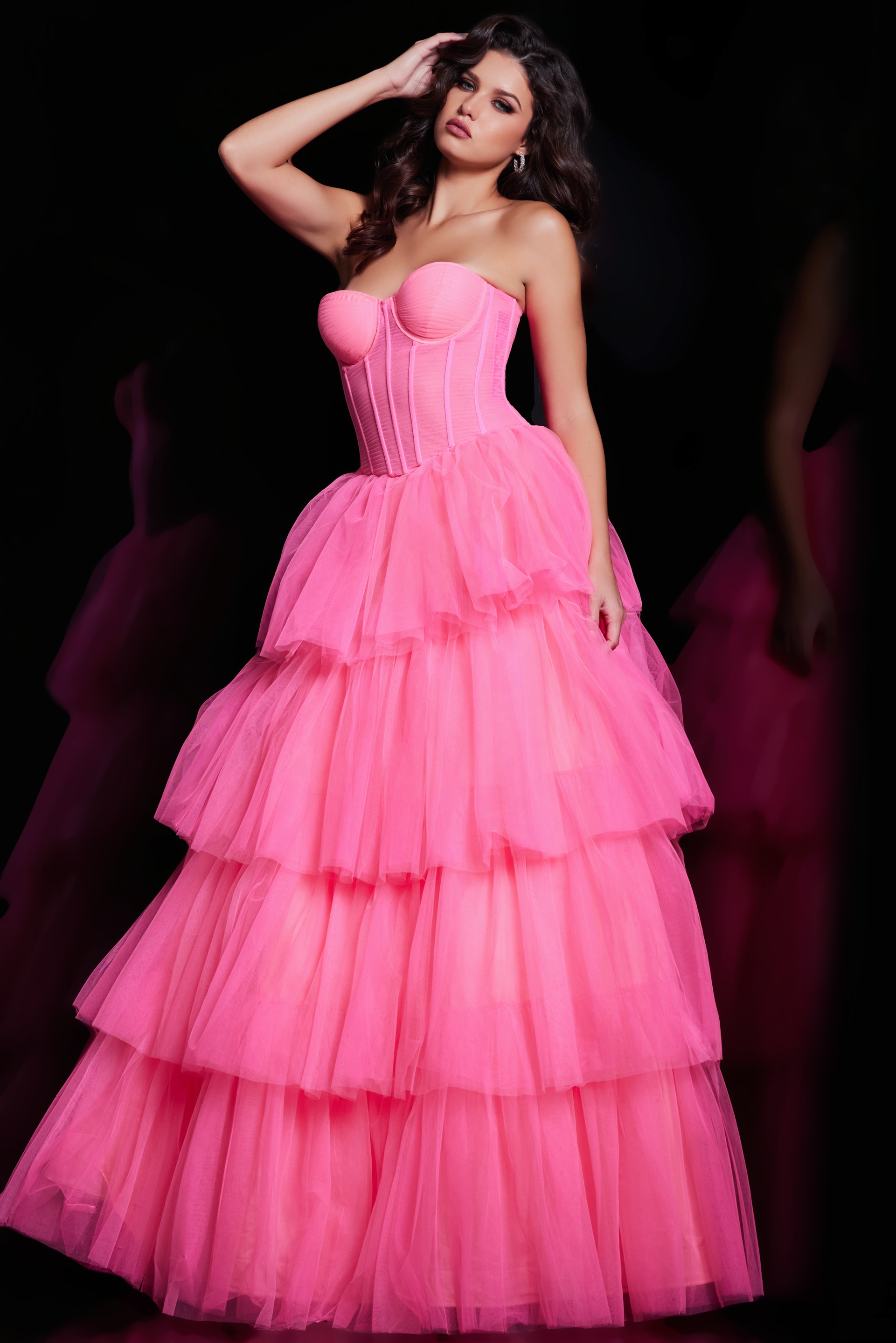 Model featuring Jovani 37062 pink gown with strapless neckline and voluminous skirt, front view.