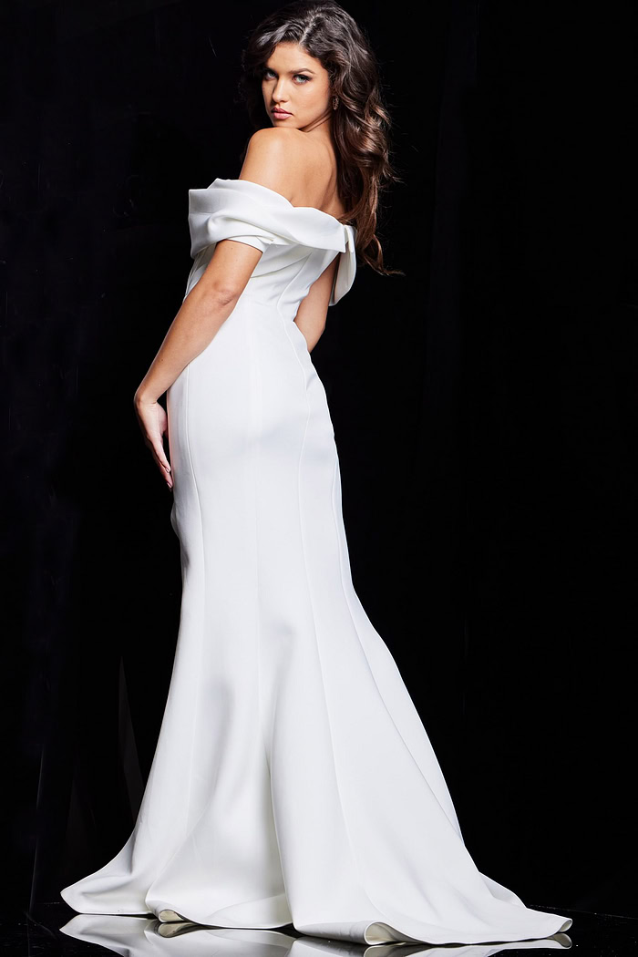 Model wearing Jovani 37148 elegant white gown viewed from the back, showing off-the-shoulder neckline and flared bottom.