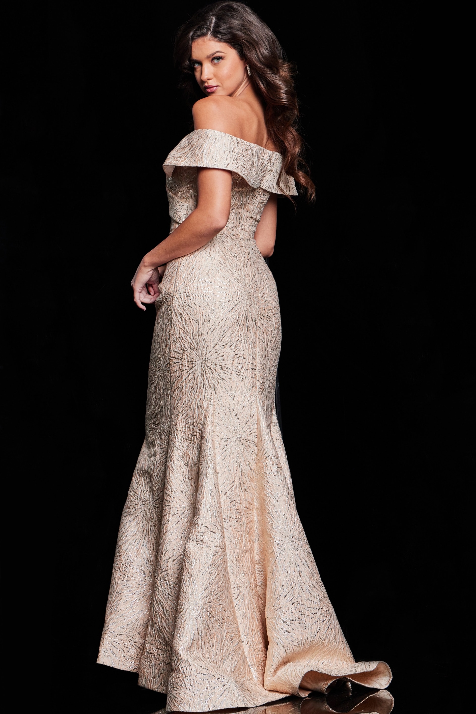 Model wearing Jovani 37394, beige off-the-shoulder gown, back view.