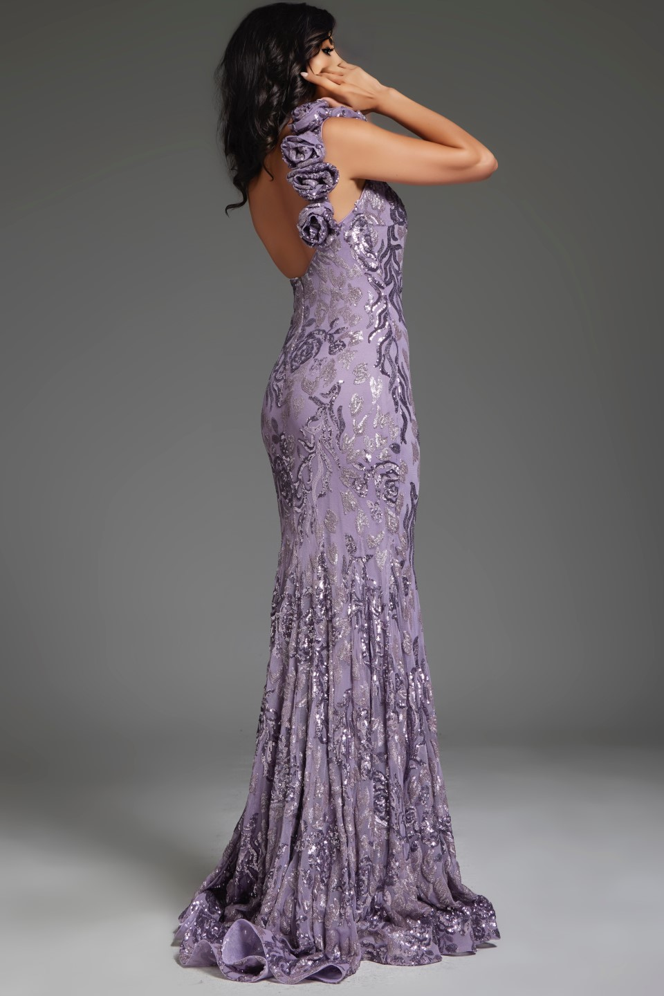 Back view of Jovani 37634 gown in lilac, displaying open back design.