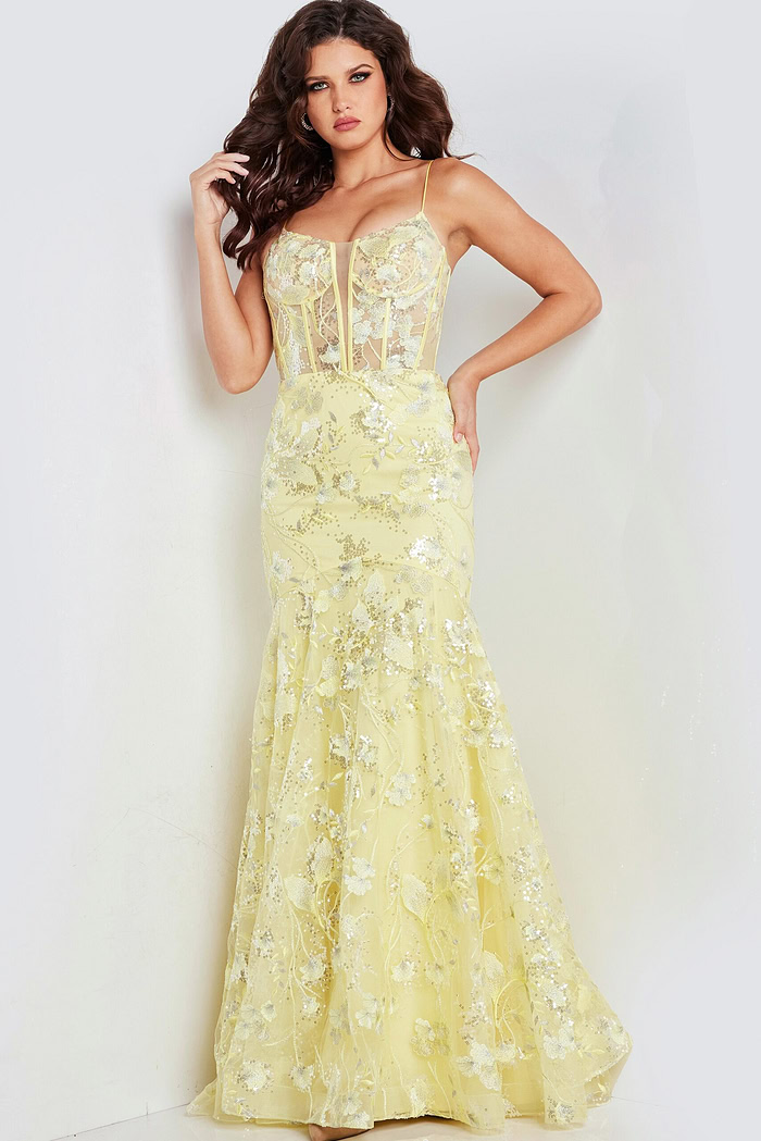 Model in Jovani 38004 yellow dress, highlighting exquisite floral embellishments.
