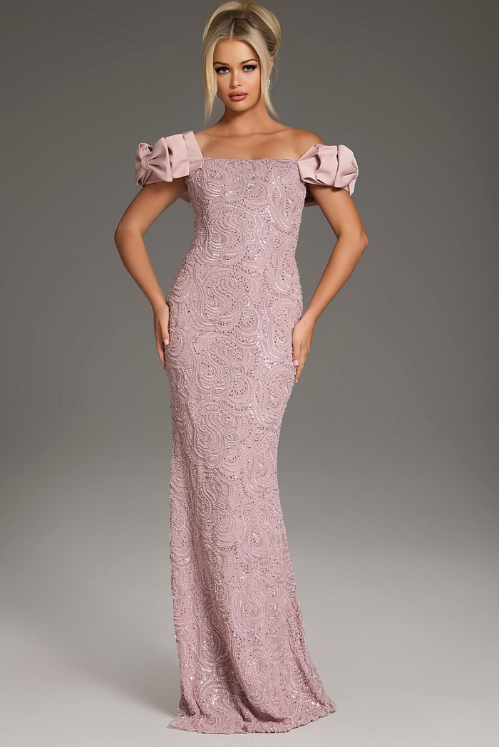 Model wearing Jovani 38112 blush mermaid gown with off-shoulder ruffled sleeves, front view.