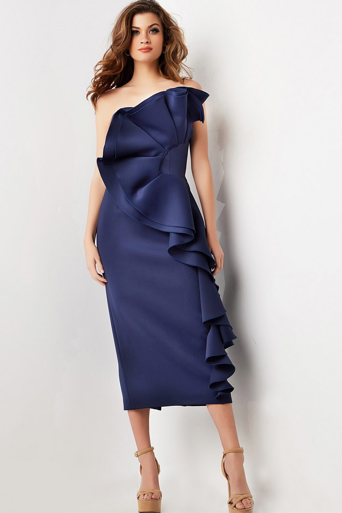 Model wearing Jovani 38187 navy dress from the front, highlighting off-the-shoulder style and dramatic ruffles.