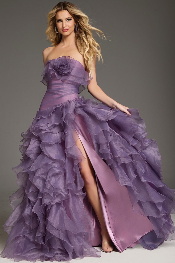 Model wearing Jovani 38236 blush gown with ruffle details, sweetheart neckline, and high slit, full length front view.