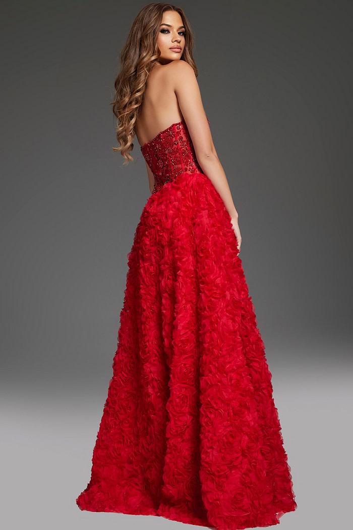 back view of model wearing Jovani 38317 red gown highlighting exquisite detailing