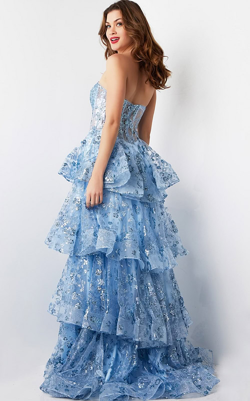 Back view of model in Jovani 38528 light blue gown with layered details
