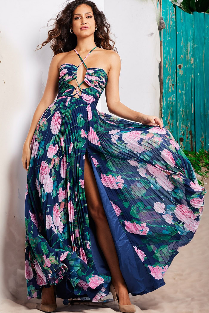 Model wearing Jovani 38638 navy floral dress with sweetheart neckline and high slit.