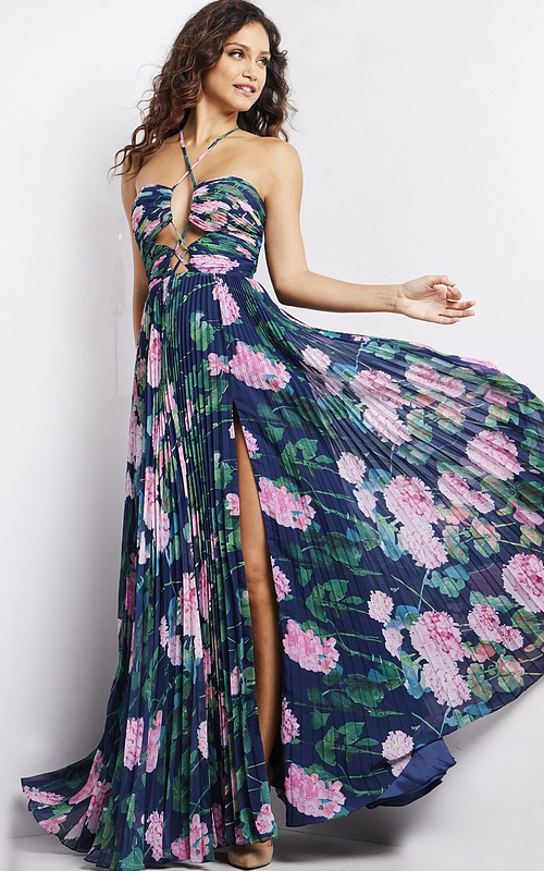 Model wearing Jovani 38638 navy floral dress with sweetheart neckline and pleated skirt.