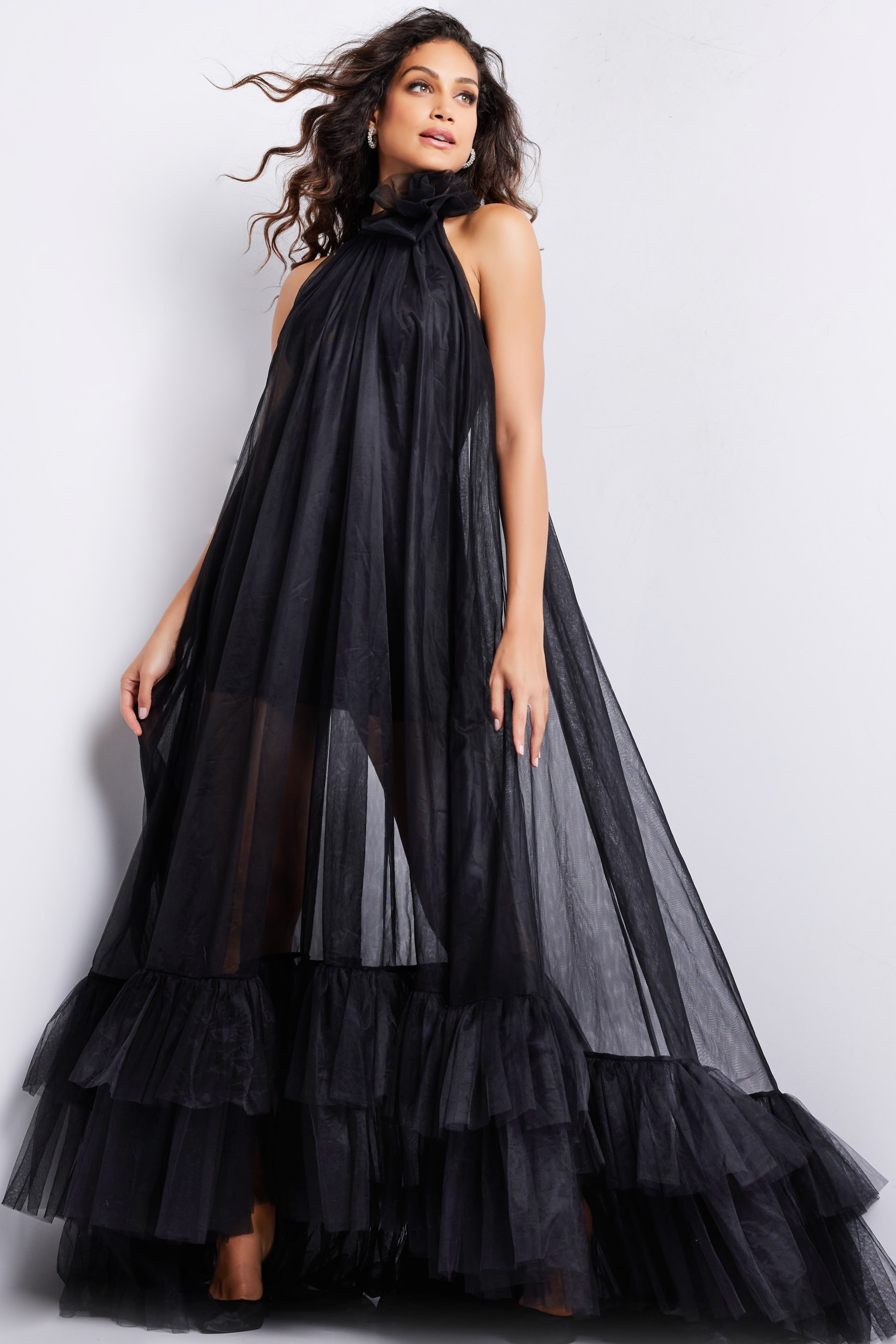 model wearing Jovani 38720 black dress with floral accent