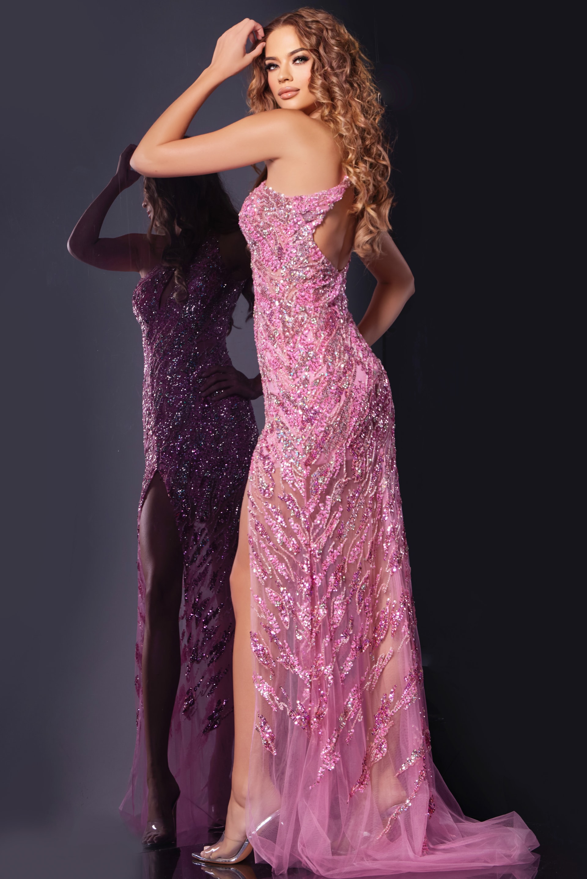Back view of model in Jovani 38769 pink gown highlighting back design.