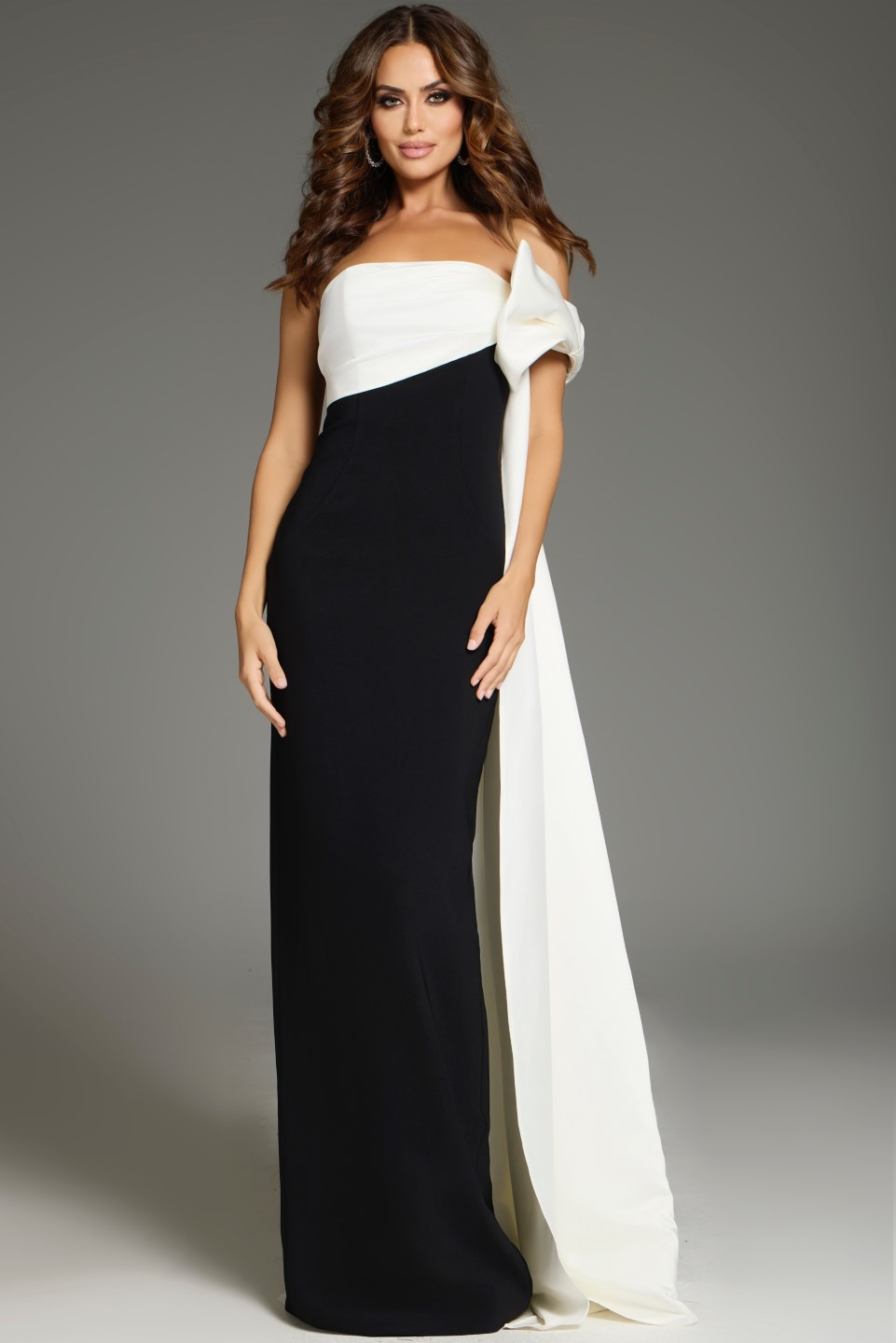Model wearing Jovani 38864 floor-length black and white gown with off-the-shoulder neckline
