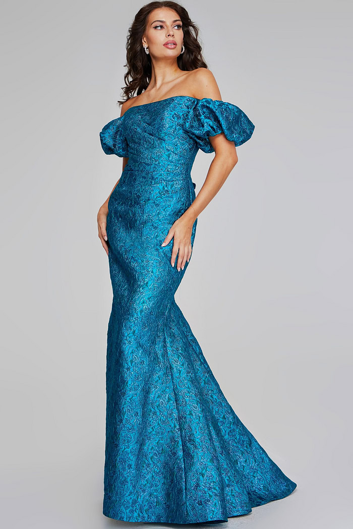 Side-front view of model in Jovani 39113, highlighting the off-the-shoulder design and puffed sleeves.