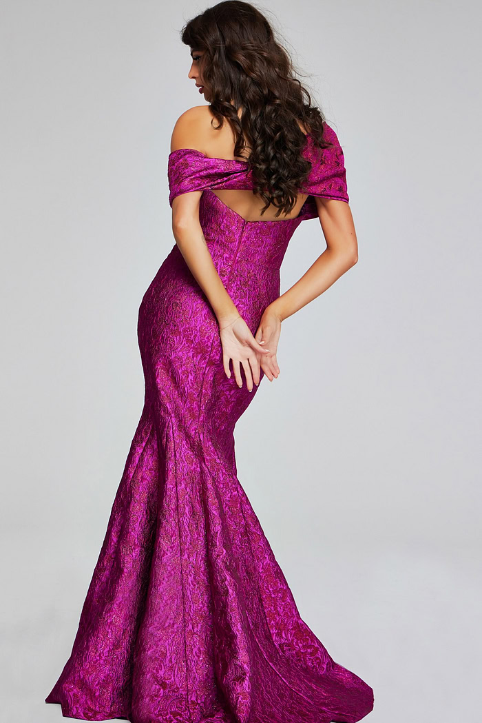Back view of model wearing Jovani 39114 fuchsia mermaid gown.