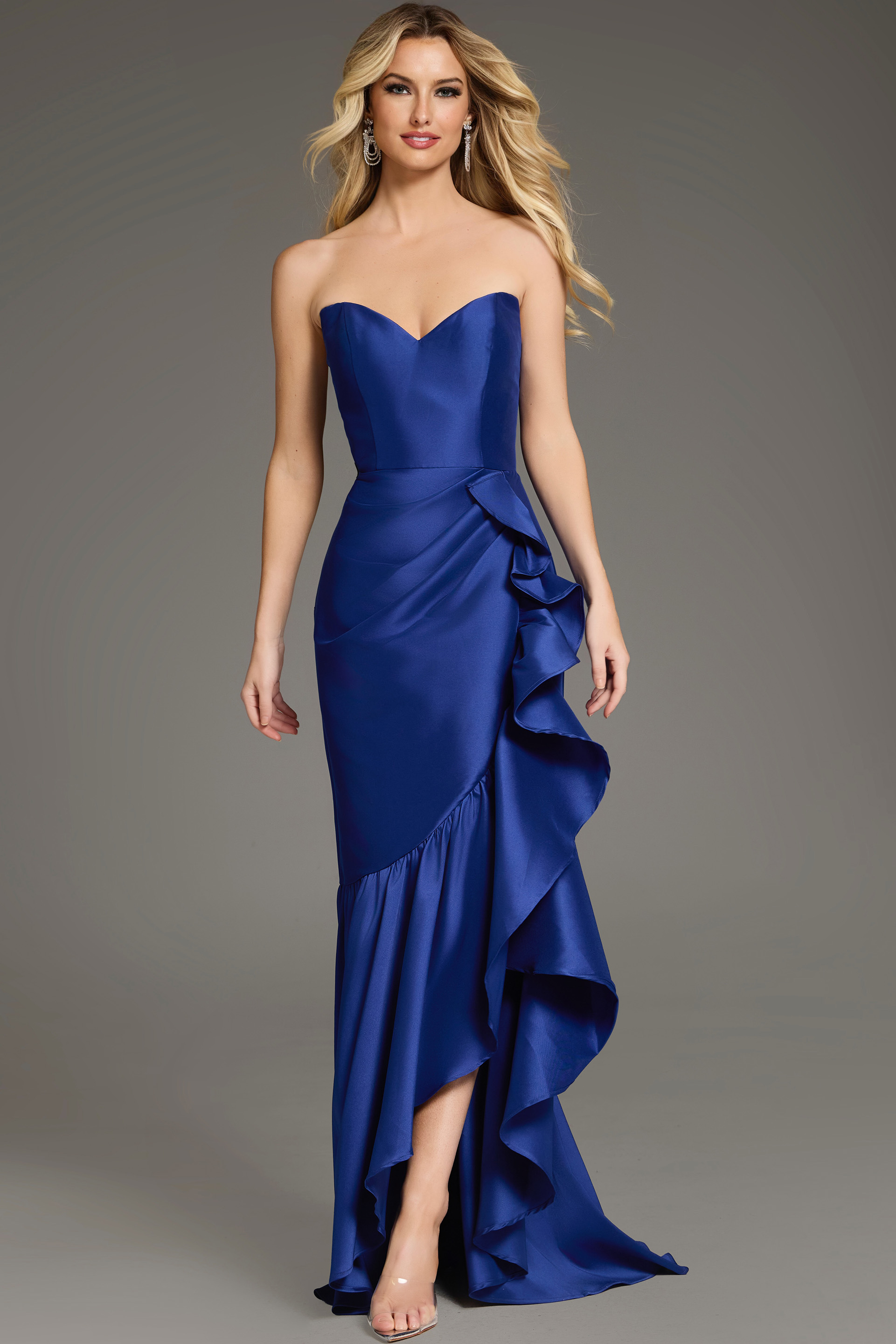 Model wearing Jovani 39265 blue gown with sweetheart neckline and ruffled skirt