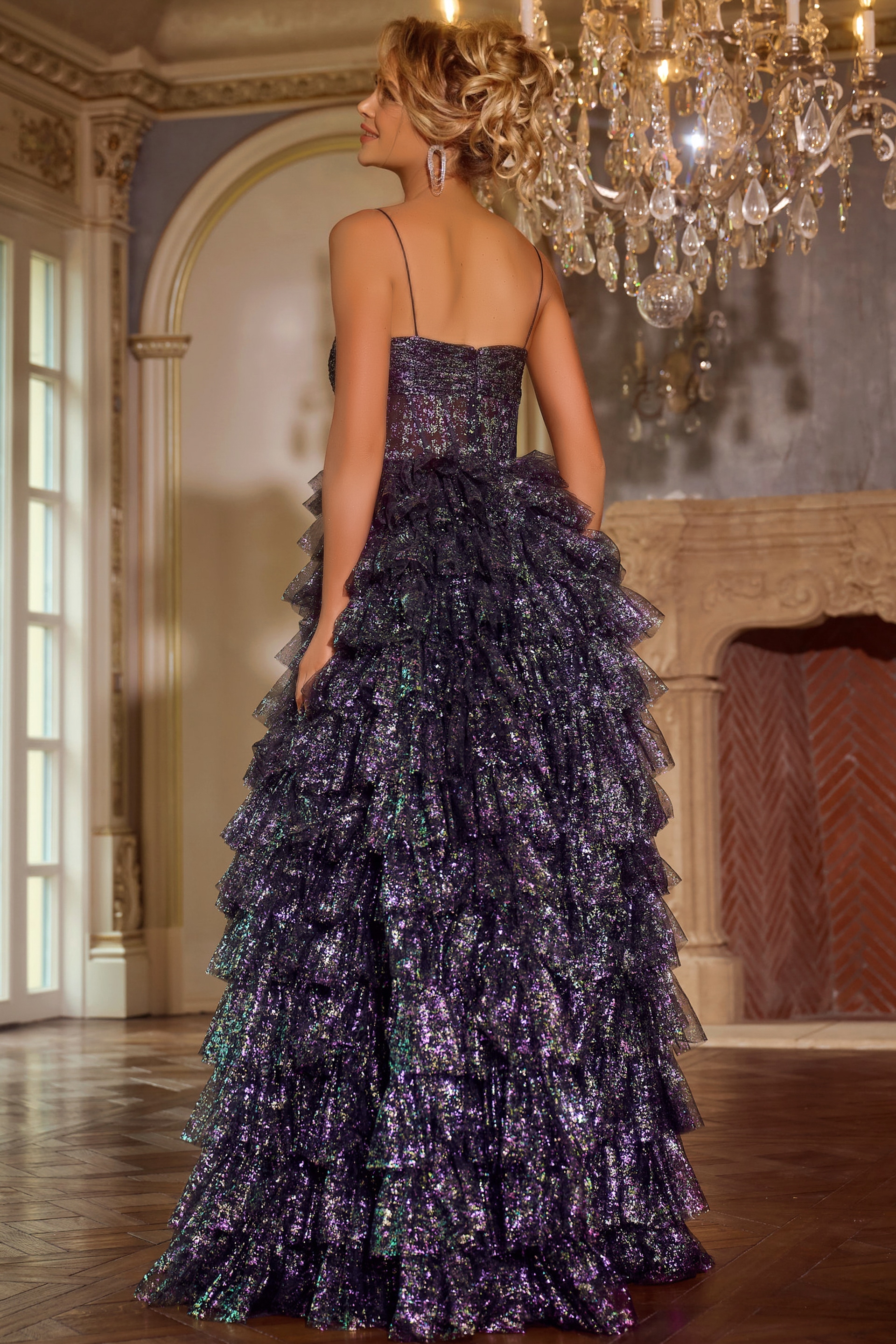 Model wearing Jovani 39305 back view showing layered ruffles on the skirt.