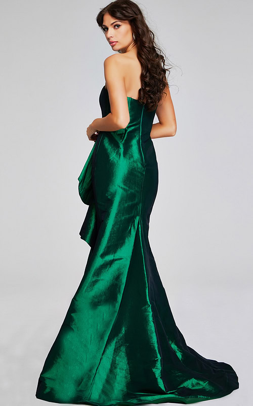 Model wearing Jovani 39368 green gown, back view showcasing mermaid silhouette.