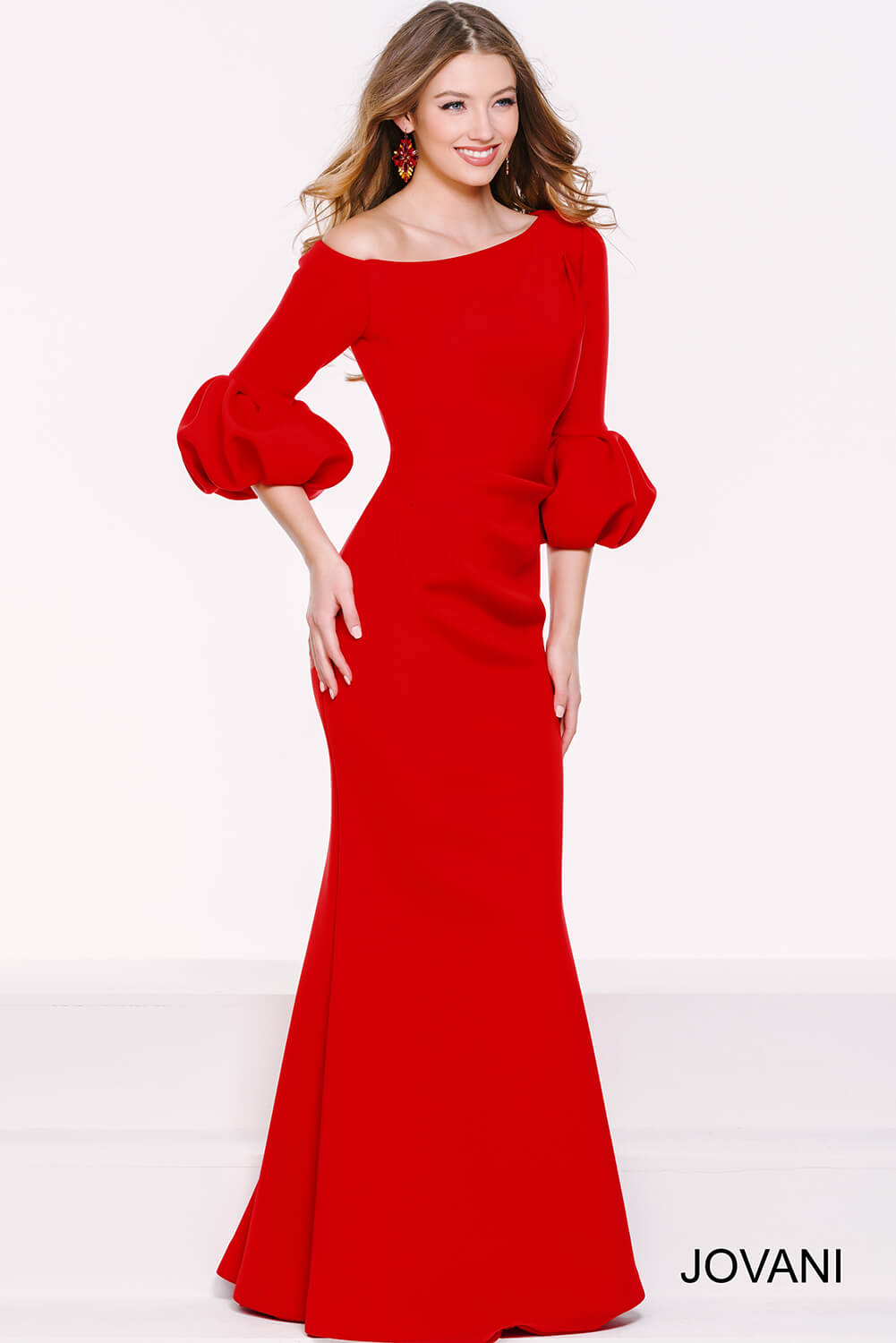 Full-length front view of model in Jovani 39739 burgundy gown.