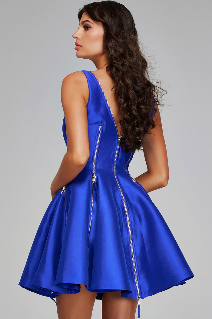 Back view of model wearing Jovani 39821, purple A-line dress showcasing zipper details.