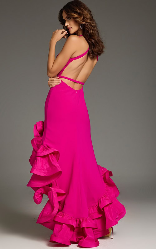 Model wearing Jovani 39893 fuchsia dress with open back and ruffled train, back view.