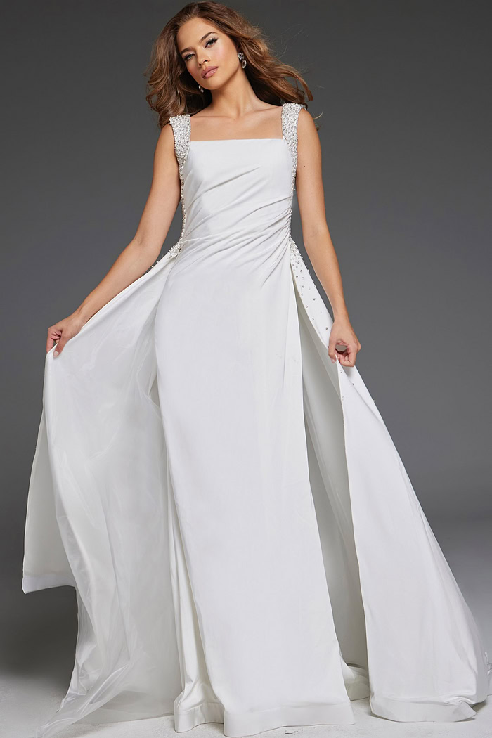 Model wearing Jovani 39921 elegant floor-length white gown with square neckline and embellished straps