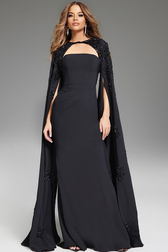 model wearing Jovani 39957 floor-length black gown with strapless neckline and embellished cape