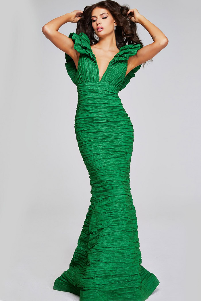 Model wearing Jovani 40044 green mermaid dress with ruched detailing and ruffled sleeves