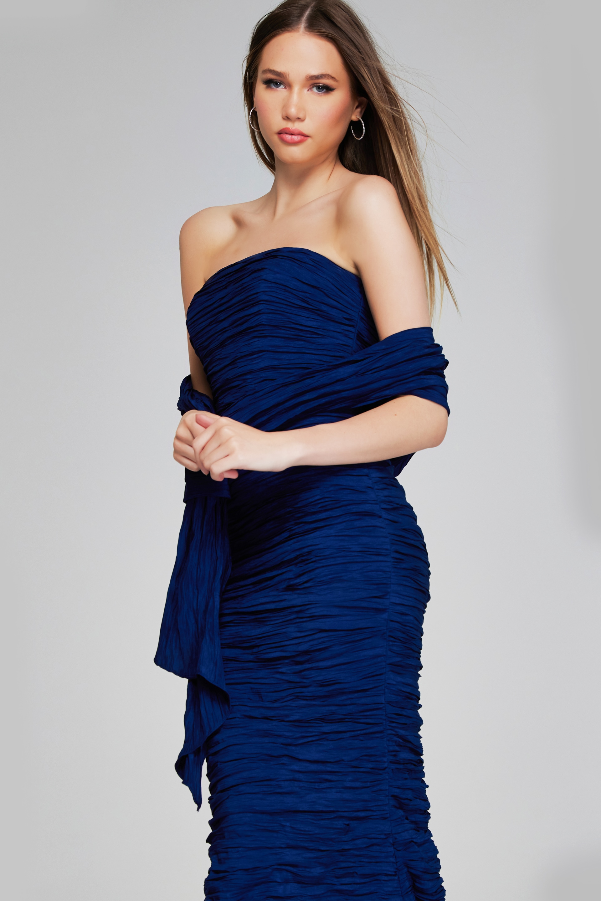 Model wearing Jovani 40045 navy mermaid gown, close-up front view.