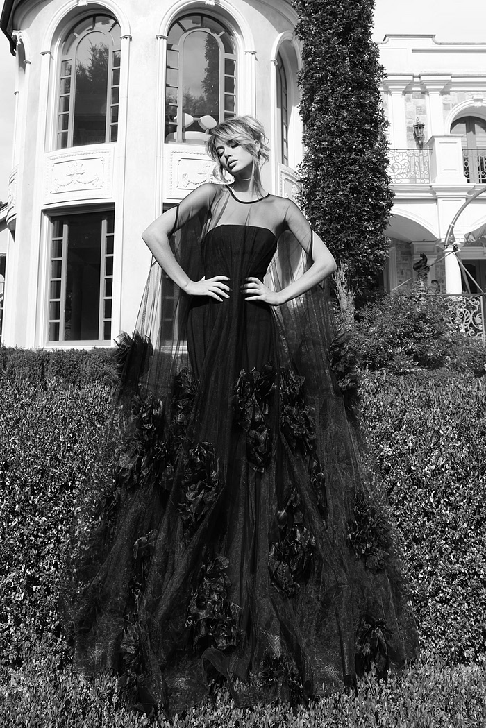 Couture-inspired sheer gown with cascading flower embellishments