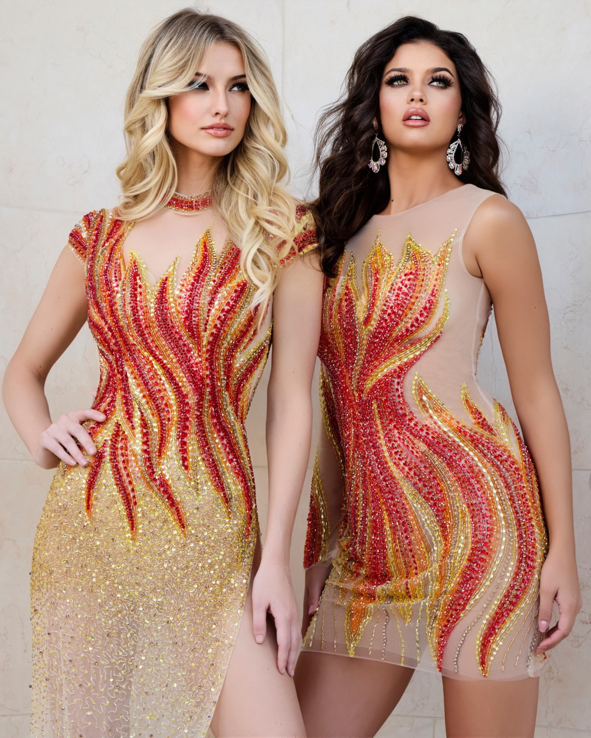 Two models wearing Jovani dresses, including 40157 with flame embellishments.