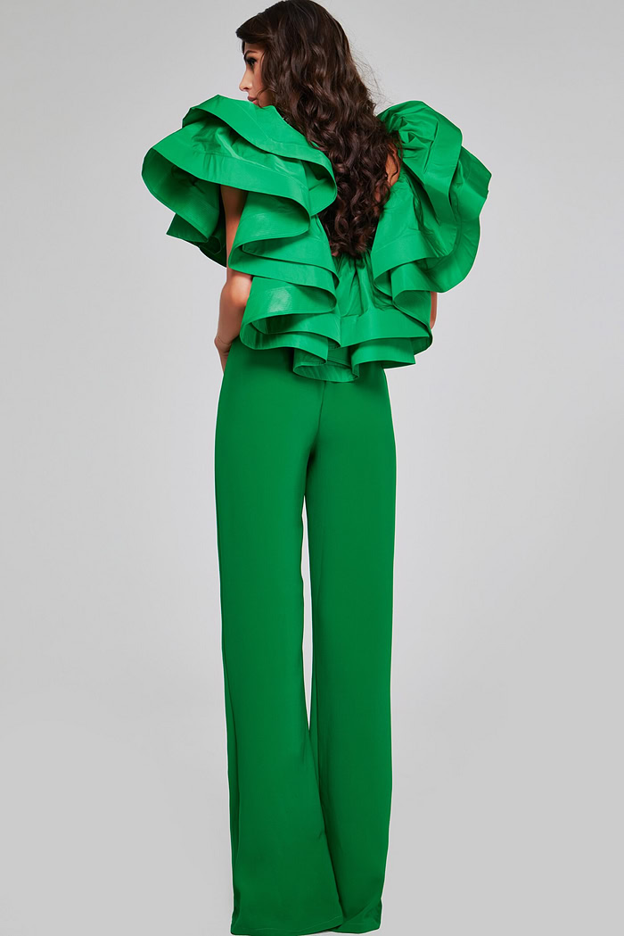 Back view of model wearing Jovani 40291 emerald green jumpsuit showing the ruffled sleeve detail.