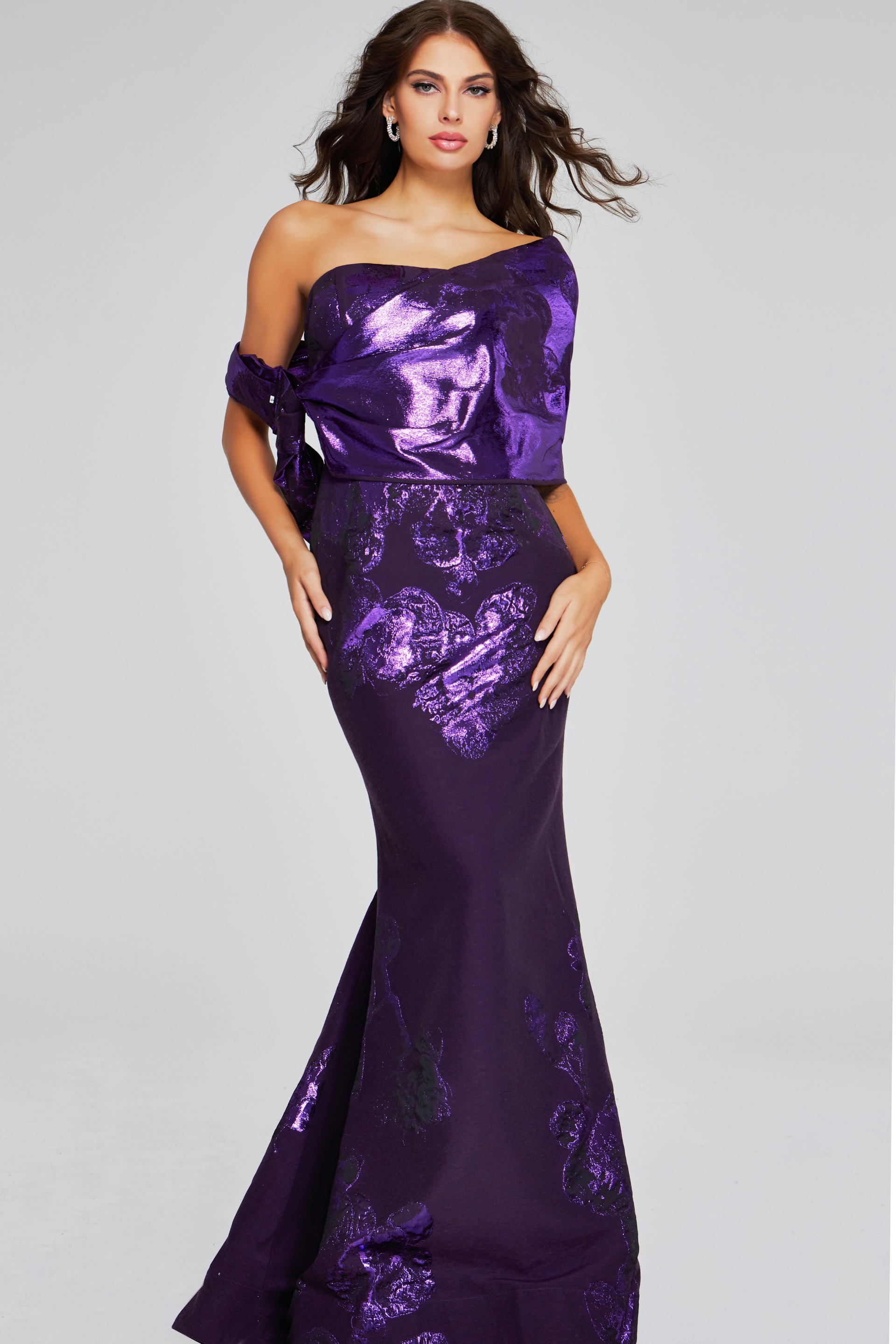 Model wearing Jovani 40318 from the back in a purple gown.